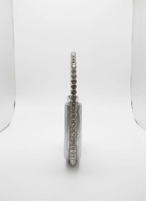 Silver earring with clear stones on a white background