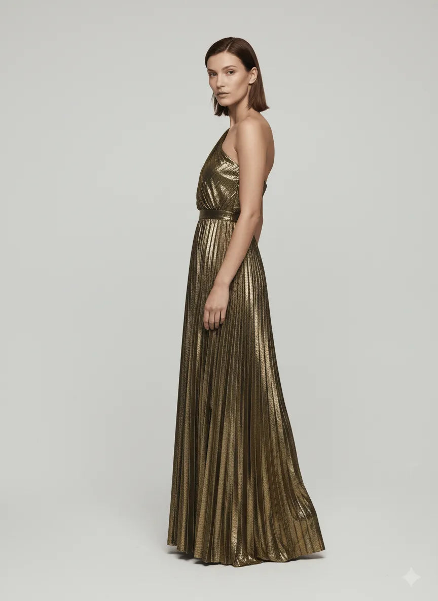 Woman wearing a metallic gold dress on a plain background