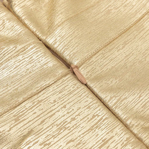 Close-up of gold metallic fabric texture