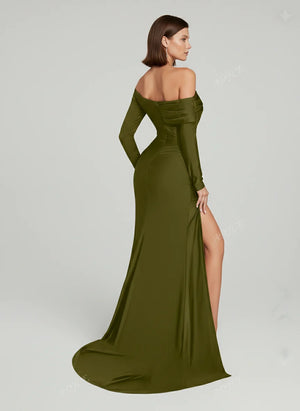 Woman wearing a green off-shoulder evening gown with a high slit on a white background