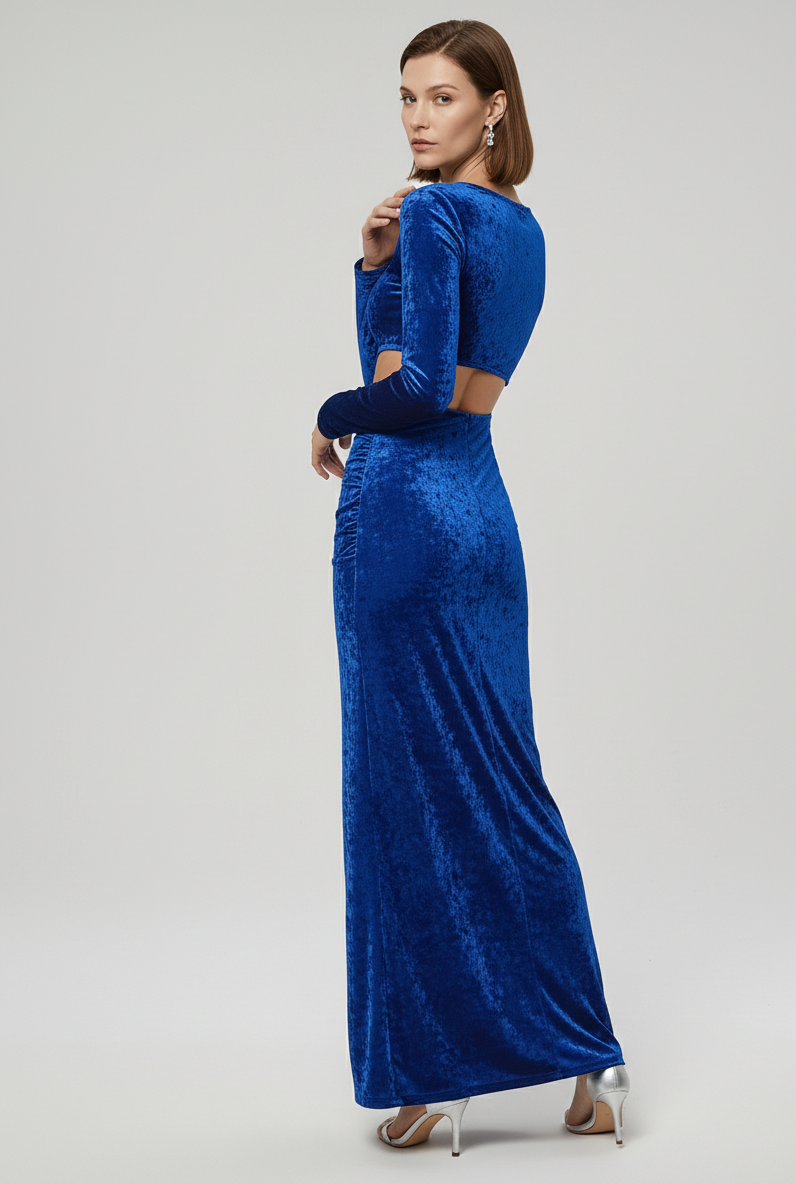 Woman wearing a blue evening gown with cut-out design on a white background