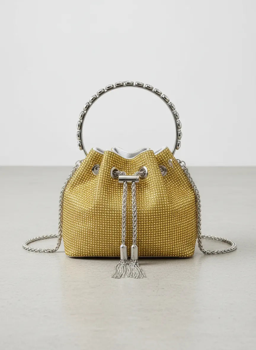 Yellow woven handbag with silver accents on a light gray background