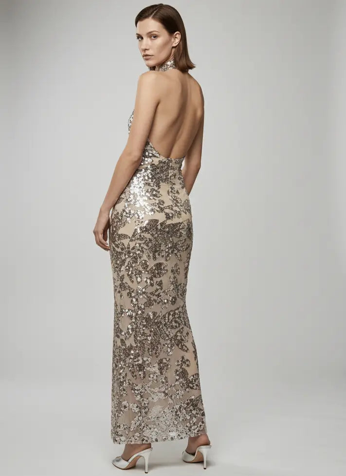 Woman wearing a sparkly evening gown with a white background