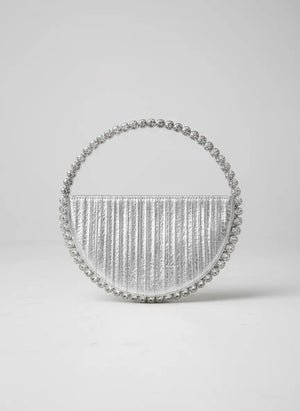 Silver handbag with beaded details on a light gray background