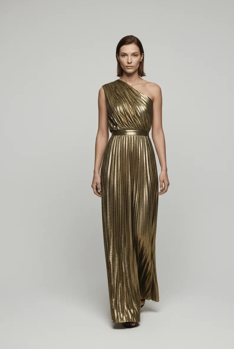 Woman wearing a gold one-shoulder evening gown on a white background