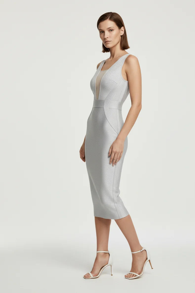 Woman wearing a light gray dress on a white background