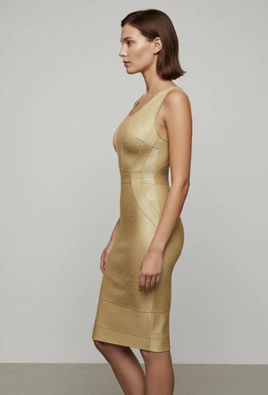 Woman wearing a beige dress against a plain background