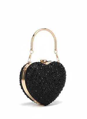 Black heart-shaped clutch bag with gold accents on a white background