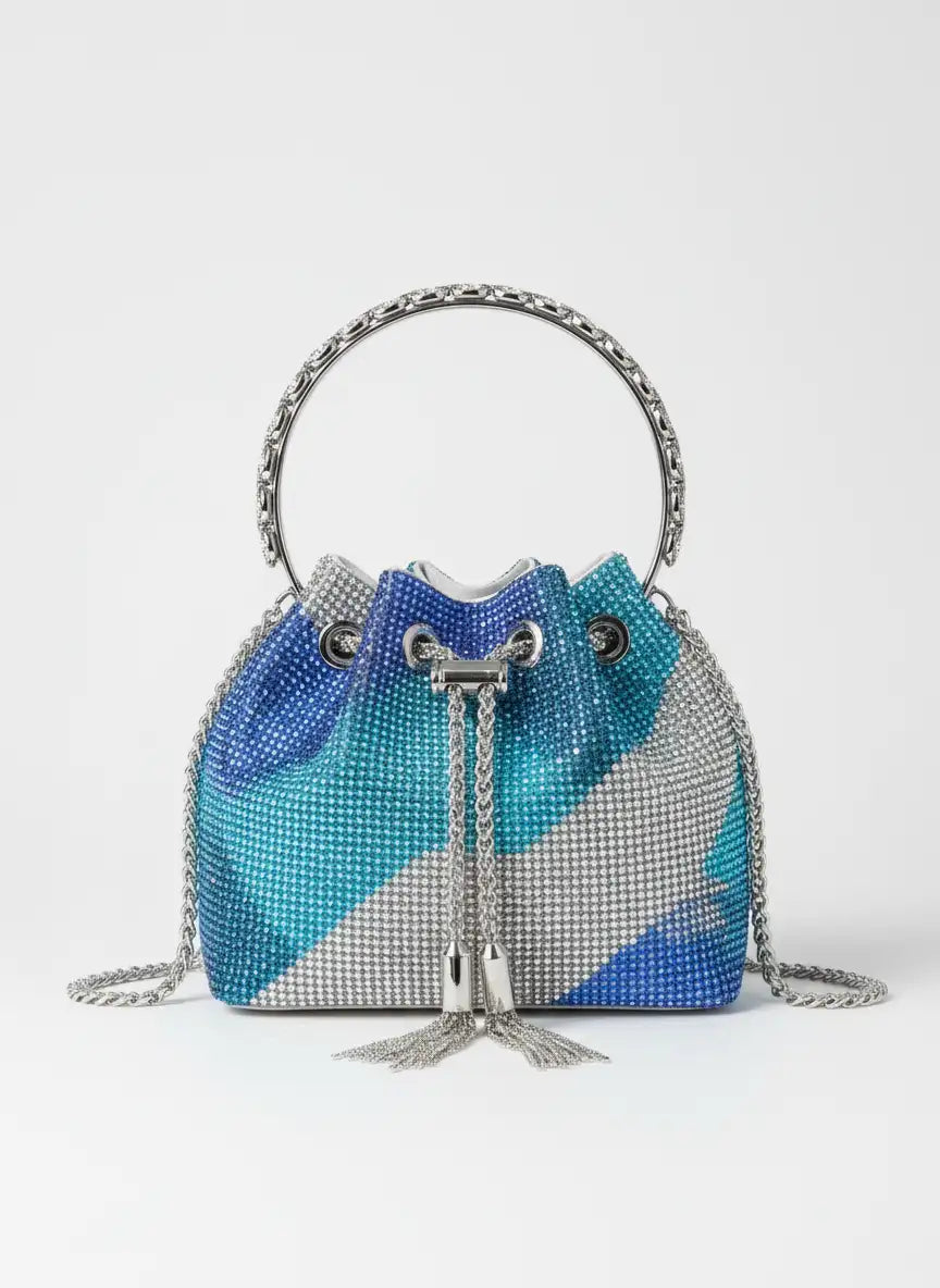 Blue, gray, and silver beaded handbag with chain details on a white background