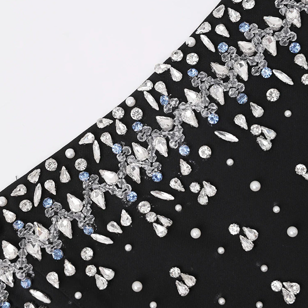 Decorative fabric with crystals and sequins on a black background