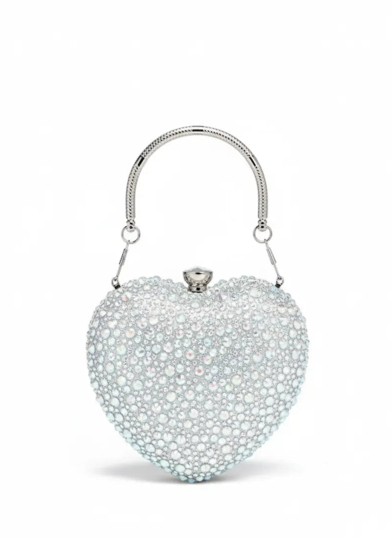 Heart-shaped handbag with sparkling details on a white background