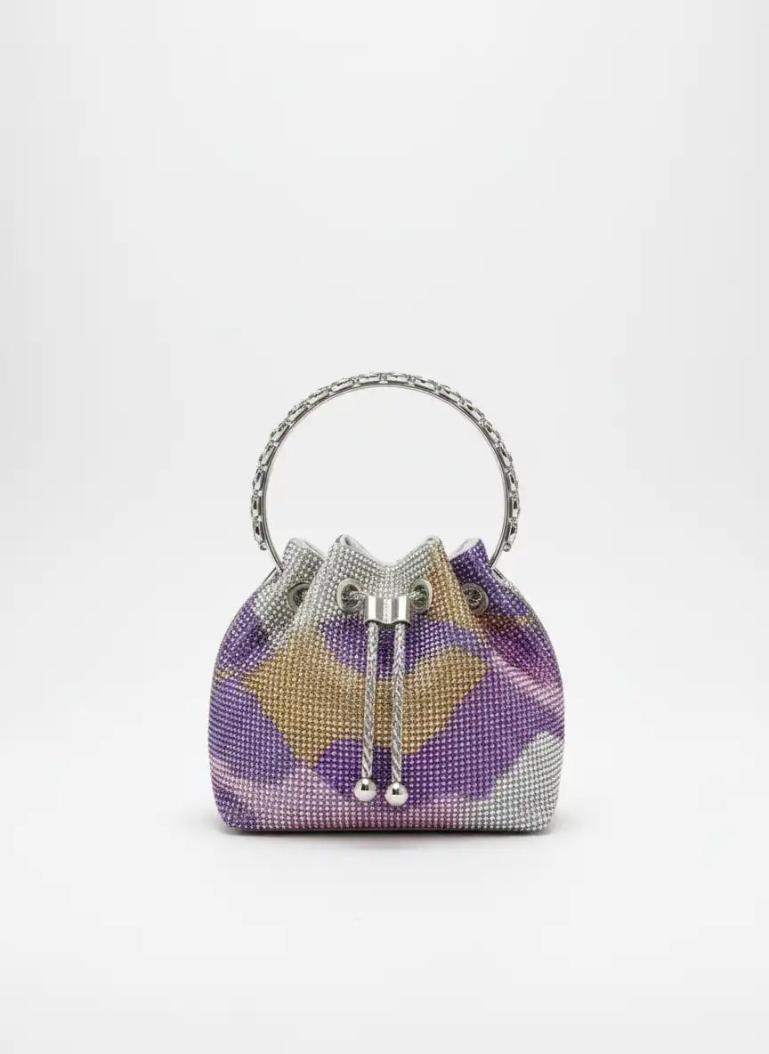 Purple and gray patterned handbag with metallic accents on a white background